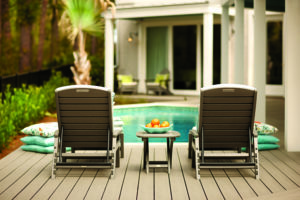two chairs by a pool on a deck